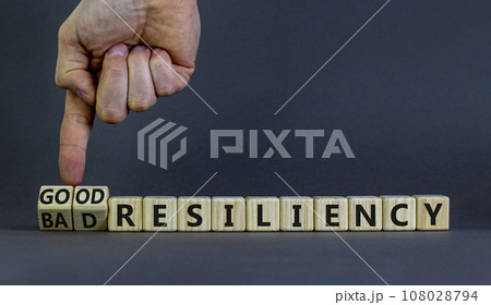 Good or bad resiliency symbol. Businessman turns wooden cubes, changes words bad resiliency to good resiliency. Beautiful grey background, copy space. Business, good or bad resiliency concept. Good or bad resiliency symbol. Businessman turns wooden cubes, changes words bad resiliency to good resiliency. Beautiful grey background, copy space. Business, good or bad resiliency concept. 108028794