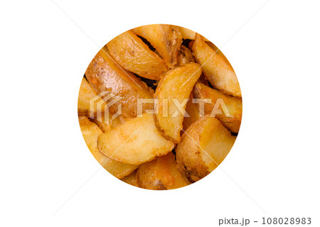 Delicious crispy fried potato wedges with salt, spices and herbs Delicious crispy fried potato wedges with salt, spices and herbs 108028983