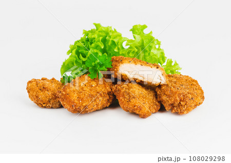 Breaded Chicken Inner Fillet on a White Background,Chicken Breaded Raw Meat.Chicken Breaded Fillet. Breaded chicken nuggets. Fast homemade food at home. Chicken breaded schnitzels. Fast cooking. Breaded Chicken Inner Fillet on a White Background,Chicken Breaded Raw Meat.Chicken Breaded Fillet. Breaded chicken nuggets. Fast homemade food at home. Chicken breaded schnitzels. Fast cooking. 108029298