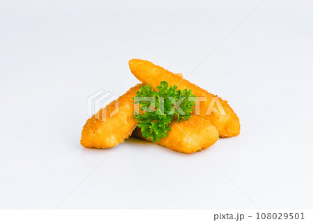 Breaded Chicken Inner Fillet on a White Background,Chicken Breaded Raw Meat.Chicken Breaded Fillet. Breaded chicken nuggets. Fast homemade food at home. Chicken breaded schnitzels. Fast cooking. 108029501