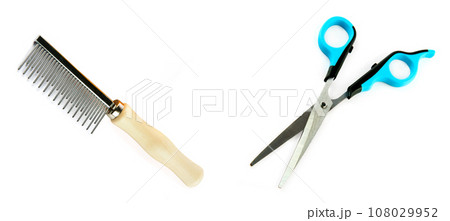 Scissors and comb for grooming dogs isolated on white . Collage. Free space for text. Wide photo. Scissors and comb for grooming dogs isolated on white . Collage. Free space for text. Wide photo. 108029952