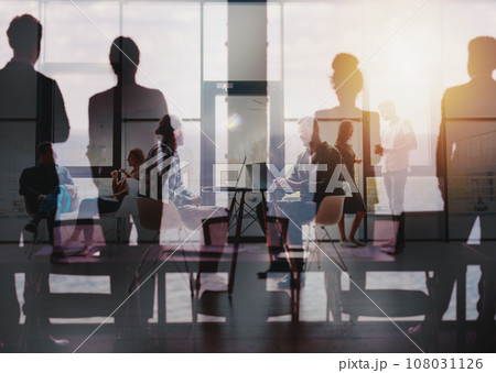 Business people that work together in office. Concept of teamwork and partnership Business people that work together in office. Concept of teamwork and partnership 108031126