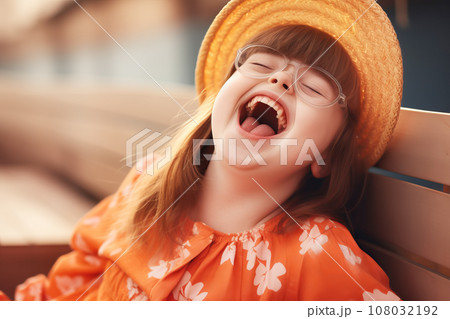 Ginger girl with down syndrome laughs outdoor Ginger girl with down syndrome laughs outdoor 108032192
