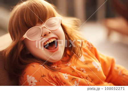 Ginger girl with down syndrome laughs outdoor 108032271