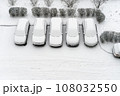 Winter parking lot cars under snow covered cars winter season. Parked cars snowy yard top view. Cover winter yard above view. Courtyard. Cold weather. Frosty morning. Fresh snow weather conditions 108032550