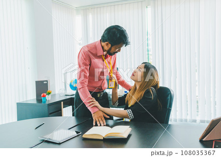 Boss or supervisor touching female employee's shoulder Causing young employees to resist because they are uncomfortable and afraid of being sexually abused. Concept of sexual harassment in the Boss or supervisor touching female employee's shoulder Causing young employees to resist because they are uncomfortable and afraid of being sexually abused. Concept of sexual harassment in the 108035367