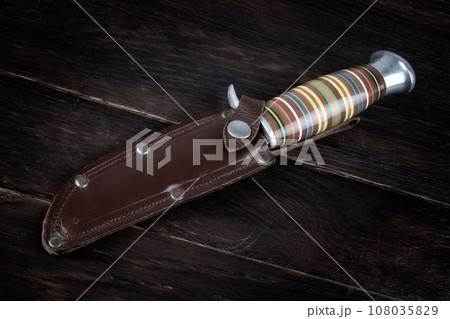 Vintage hunting knife with leather holster 108035829