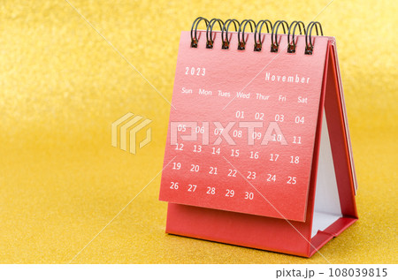 The Red November 2023 Monthly desk calendar for 2023 year on golden color background. 108039815