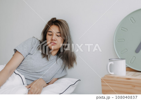 Displease and unhappy woman has to wake up in the morning. Displease and unhappy woman has to wake up in the morning. 108040837