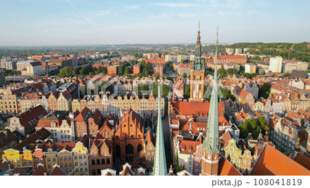 St Mary's Cathedral Beautiful panoramic architecture of old town in Gdansk, Poland at sunrise. Aerial view drone pov. Landscape cityscape City from Above. Small vintage historical buildings Europe 108041819