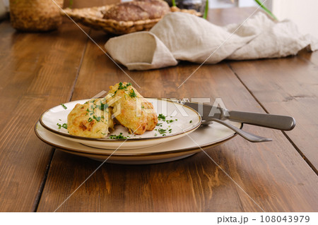 Meat cutlets baked in oven on a plate 108043979