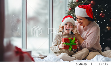 mom and daughter exchanging gifts 108045615