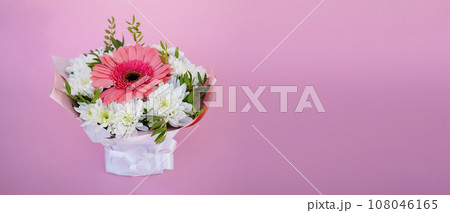A beautiful bright bouquet of blooming fresh gerberas for a gift collected by an experienced florist 108046165
