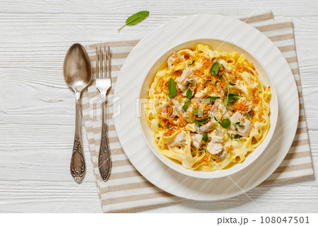 creamy chicken and mushroom tagliatelle in bowl creamy chicken and mushroom tagliatelle in bowl 108047501