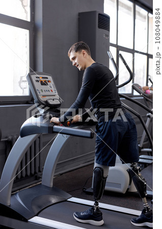 young active man with great willpower working out at sport center young active man with great willpower working out at sport center 108049884