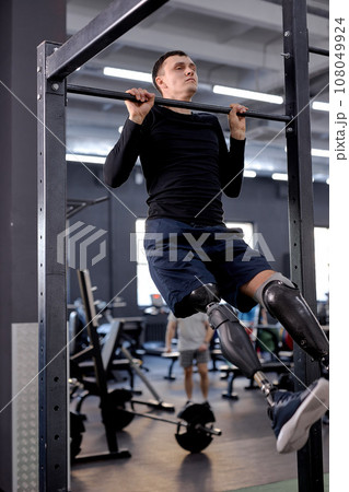 young motivated man building upper body strength 108049924