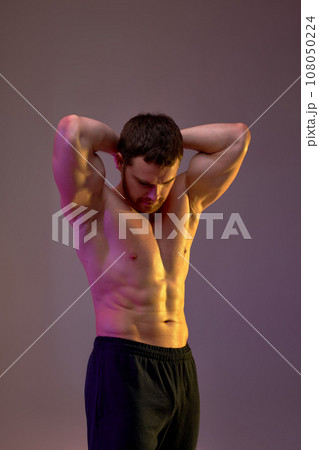 motivated ambitious young sportsman showing his perfect body 108050224