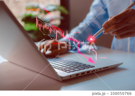 Economic collapse. Businessman using laptop with downward arrow, crisis chats, debt, recession, market collapse, financial problems, inflation, financial crisis economic recession slowing down. 108050766