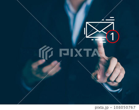 E-mail alert notification. Businessman hands hold smartphone and touch email icon and send e-mail or newsletter. Electronic mail marketing and online working internet network concept. 108050767