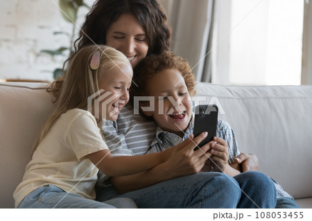Happy blogger mother and little son and daughter taking selfie 108053455