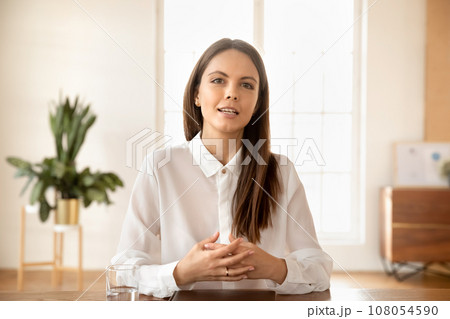 Confident pretty young business blogger woman speaking on online streaming Confident pretty young business blogger woman speaking on online streaming 108054590