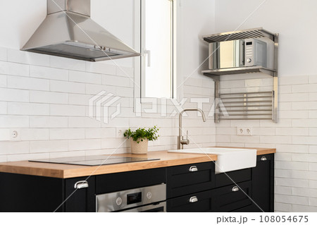 Devices for food preparation and sink in stylish kitchen 108054675