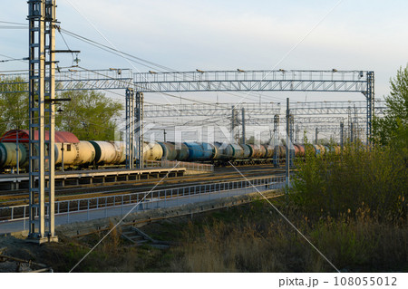 Evening view of the railway, on which there are tank cars 108055012