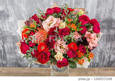Small Beautiful bouquet of mixed flowers in vase. Floral shop concept . Beautiful fresh cut bouquet. Flowers delivery 108055288