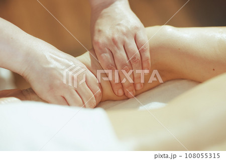 Closeup on medical massage therapist massaging clients arm Closeup on medical massage therapist massaging clients arm 108055315