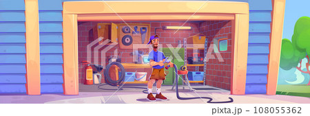 Young man stands at entrance to garage 108055362