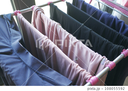 child clothes line filled with hanging trousers 108055592