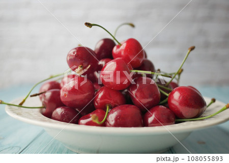 ripe fresh cherry in a bowl on table ripe fresh cherry in a bowl on table 108055893