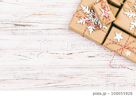 Christmas wooden background with gift boxes and decor. Top view with copy space for your text. Toned 108055926