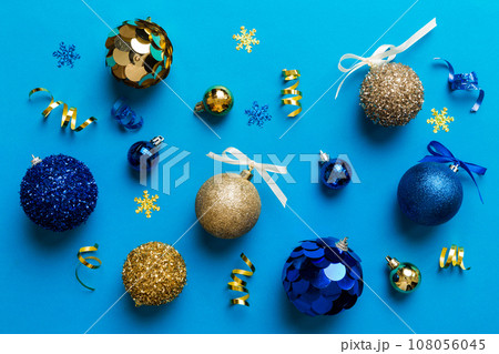 Christmas ball on colored background. decoration bauble with ribbon bow with copy space Christmas ball on colored background. decoration bauble with ribbon bow with copy space 108056045