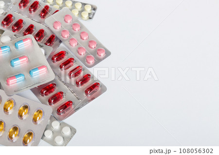 too many different pill of various blisters with different pills Medicines storage at home concept Medication storing. A pile of medicine in blister packs. Pharmaceutical blister packs 108056302
