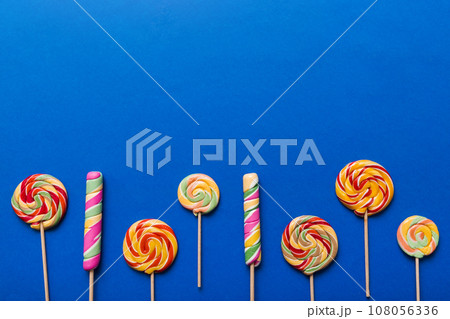 Set of colorful lollipops on colored background. Summer concept. Party Happy Birthday or Minimalist Concept 108056336