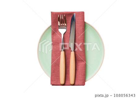 isolated christmas Plate with decor and fork and spoon. New year holiday background. Top view isolated christmas Plate with decor and fork and spoon. New year holiday background. Top view 108056343