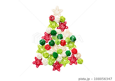 Isolated Christmas tree made from colored handmade ball decoration on colored background, view from above. New Year minimal concept 108056347