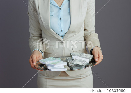Trendy business owner woman in light business suit 108056804