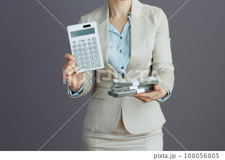 Closeup on female employee in light business suit 108056805