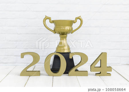 2024 new year and golden trophy on white wood table over white background with copy space , winner or success concept 2024 new year and golden trophy on white wood table over white background with copy space , winner or success concept 108058664