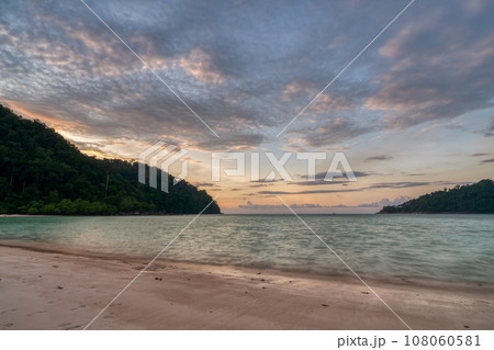Beautiful sunsset at Mai ngam beach in Koh Surin national park, the famous free driving spot in Pang Nga, Thailand. Beautiful sunsset at Mai ngam beach in Koh Surin national park, the famous free driving spot in Pang Nga, Thailand. 108060581
