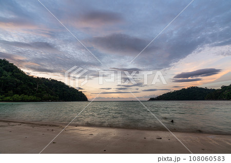 Beautiful sunset at Mai ngam beach in Koh Surin national park, the famous free driving spot in Pang Nga, Thailand Beautiful sunset at Mai ngam beach in Koh Surin national park, the famous free driving spot in Pang Nga, Thailand 108060583
