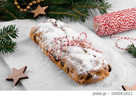 Christmas stollen as a gift, traditional festive German bread, Holiday pastry dessert, recipe Christmas stollen as a gift, traditional festive German bread, Holiday pastry dessert, recipe 108061821