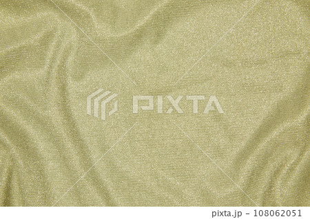 Background of draped light green fabric with silver lurex thread 108062051