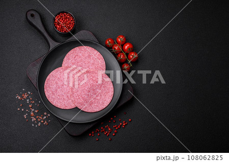 Delicious smoked salami sausage with salt, spices and herbs Delicious smoked salami sausage with salt, spices and herbs 108062825