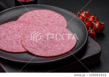 Delicious smoked salami sausage with salt, spices and herbs Delicious smoked salami sausage with salt, spices and herbs 108062828