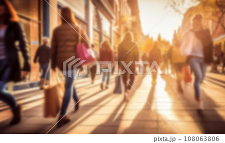 Busy shopping street in the city. Rush hour. Motion blurred crowd of shopping walking on busy fashion shop street. Crowd of people shoppers walking in the streets blurred background 108063806