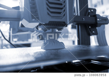 3D printer. 3D printer printing process close-up. 3D printer creating object from molten plastic. 3D printing. Innovation additive robotic technology. Modern three-dimensional printing technologies 3D printer. 3D printer printing process close-up. 3D printer creating object from molten plastic. 3D printing. Innovation additive robotic technology. Modern three-dimensional printing technologies 108063958