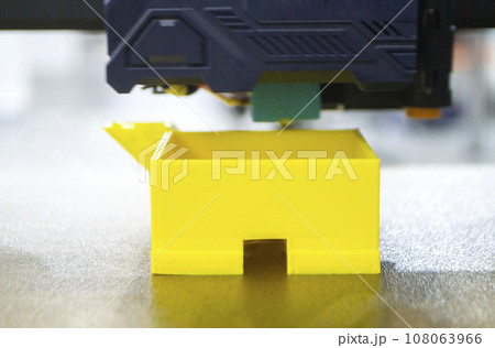 Working 3D printer printing an object from plastic. Printing a model from molten plastic using a 3D printer. Creation of a form by a 3D printer. Additive progressive new modern 3d printer technology Working 3D printer printing an object from plastic. Printing a model from molten plastic using a 3D printer. Creation of a form by a 3D printer. Additive progressive new modern 3d printer technology 108063966